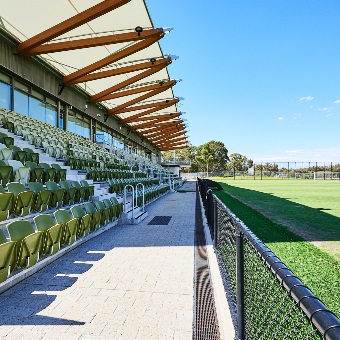 A close up photo of the grandstand seating at the Sam Kerr Football Centre in Queens Park, Perth