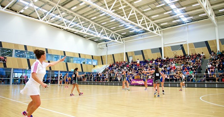 A photo of a netball match being played at the Gold Netball Centre in Jolimont, Perth