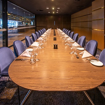 Photo of a boardroom like long table in a meeting room at Optus Stadium in Burswood, Perth
