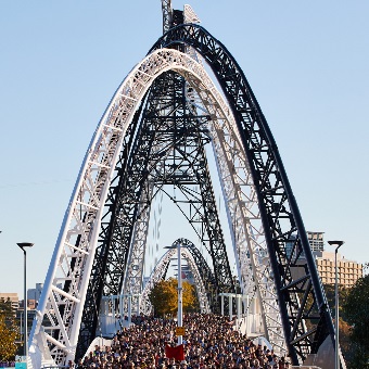 A photo of a large crowd walking across the Matagarup Bridge in Burswood, Perth