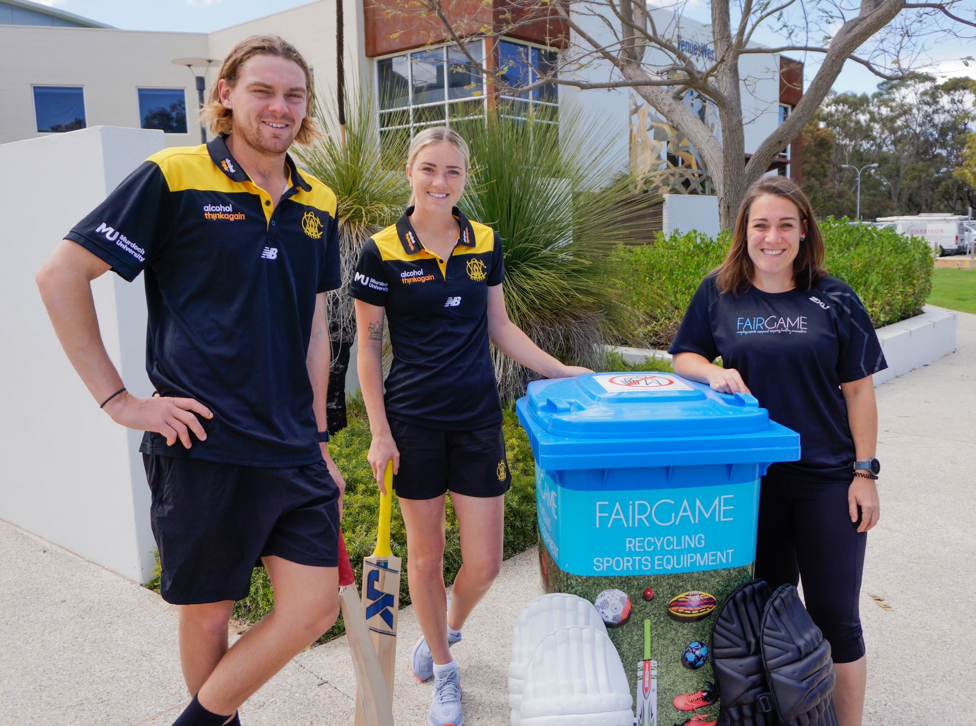 Photo of three people next to a bin promoting Fair game, a VenuesWest partner
